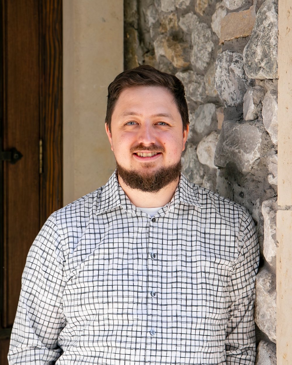 Justin Daddona, CAS Manager at The Finance Squad, at the office entrance