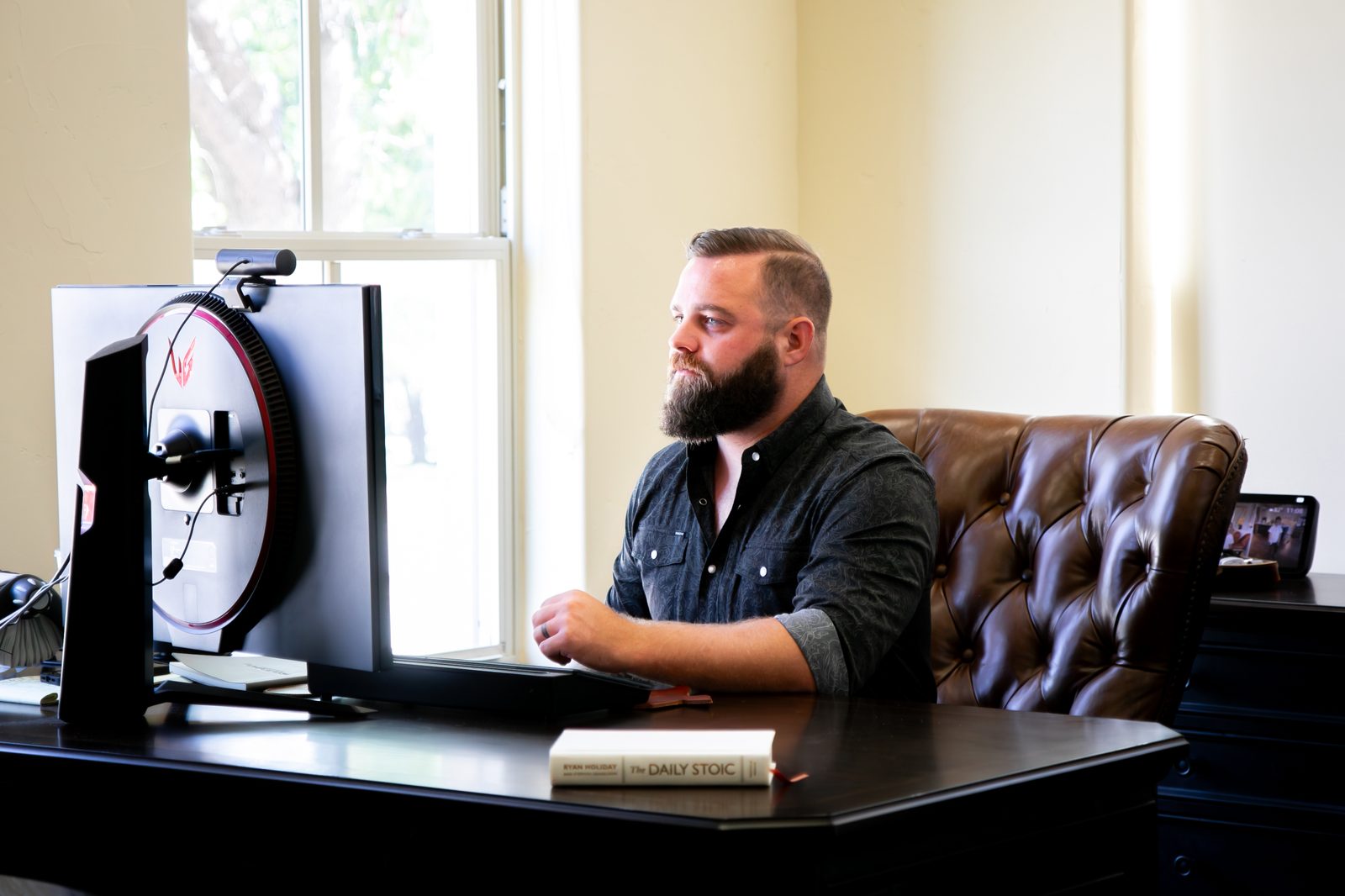 Working at a desk in The Finance Squad office in McKinney