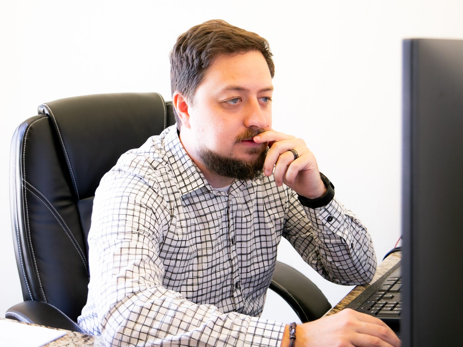 A team member concentrating at his workstation